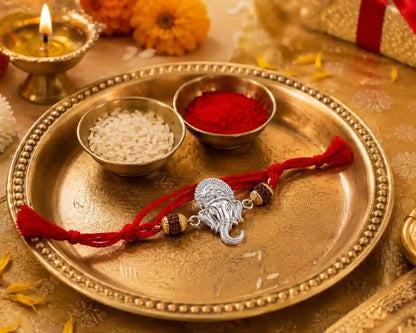 99.5% Fine Silver Ganesh ji Rakhi Studded with Natural 5 Mukhi Rudraksh