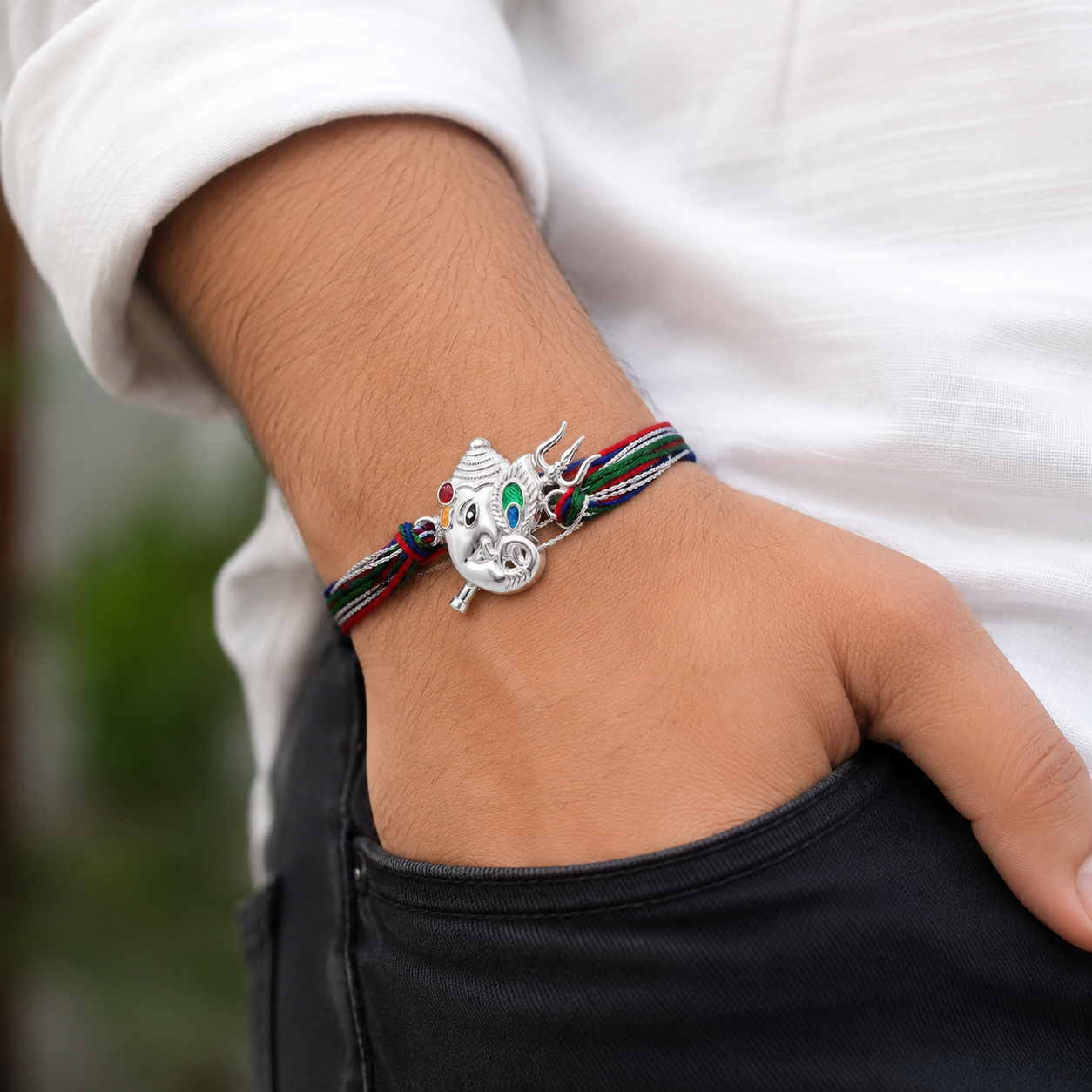 Silver Lord Ganesha Trishul Rakhi for Brother wear on hand  with multicolor thread for Raksha Bandhan by Madhaviya Jewels