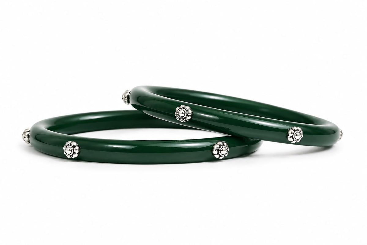 Glossy green bangles with silver floral embellishments
