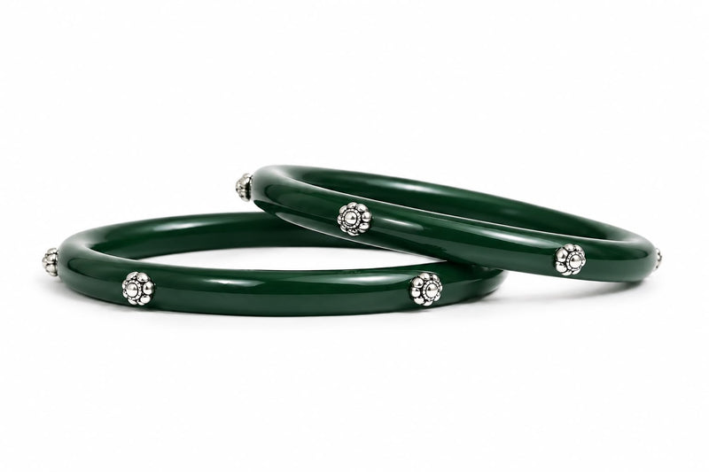 Glossy green bangles with silver floral embellishments