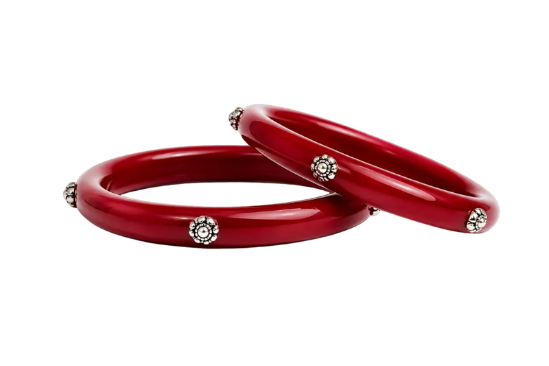 Glossy red bangles with silver floral embellishments