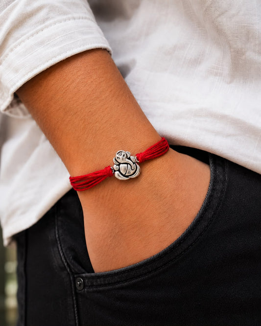 99.5% Pure Silver Ganesha Rakhi with Red  Thread for Brother by Madhaviya Jewels